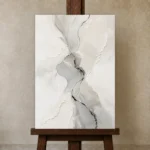 Silver Flow Neutral Abstract Wall Art Canvas Print displayed on a studio easel