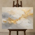 Aureate Cloudscape Gold Abstract Wall Art Canvas Print displayed on a studio easel