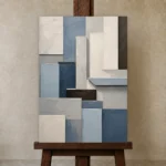Blue Architectural Blocks Geometric Abstract Wall Art Canvas Print displayed on a studio easel