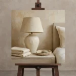 Ivory Ceramic Lamp Serene Neutral Bedroom Wall Art Canvas Print displayed on a studio easel