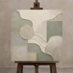 Sage Sculptural Geometry Quiet Focus Wall Art Canvas Print displayed on a studio easel
