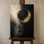 Golden Eclipse Black & Gold Wall Art Canvas Print displayed on a studio easel