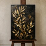 Golden Olive Branch Botanical Black & Gold Wall Art Canvas Print displayed on a studio easel