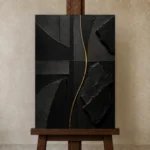 Golden Rift Abstract Black & Gold Wall Art Canvas Print displayed on a studio easel