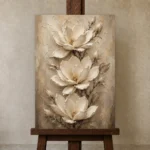 Three Ivory Blossoms Magnolia Wall Art Canvas Print displayed on a studio easel