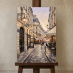 Paris Cafe Street Paris Cityscape Wall Art Canvas Print displayed on a studio easel