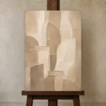Beige Architectural Neutral Living Room Wall Art Canvas Print displayed on a studio easel