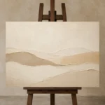 Soft Clay Dunes Minimalist Wall Art Canvas Print displayed on a studio easel
