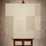 Ivory and cream Minimalist Wall Art print featuring a raised panel grid and off-center oval for elegant interiors