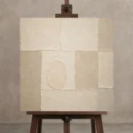 Cream Oval Grid Minimalist Wall Art Canvas Print displayed on a studio easel