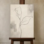 Ivory Botanical Minimalist Wall Art Canvas Print displayed on a studio easel