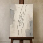 Ivory Hand Line Minimalist Wall Art Canvas Print displayed on a studio easel