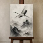 Zen Crane and Mountain Fog Ink Wash Wall Art Canvas Print displayed on a studio easel