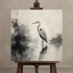 Tranquil Heron Reflection Ink Wash Wall Art Canvas Print displayed on a studio easel