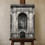 Historic Facade Monochrome Wall Art Canvas Print displayed on a studio easel