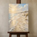 Golden Coastal Light Beach Wall Art Canvas Print displayed on a studio easel
