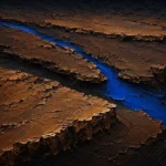 Brown abstract wall art print featuring layered walnut strata, cobalt blue fissures, and textured surfaces for elegant interiors