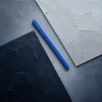 Silver and cobalt minimalist neutral abstract art print featuring geometric planes and a blue accent for elegant interiors