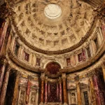 Merlot and antique gold roman architecture prints featuring a Roman pantheon interior with columns, dome, and classical details