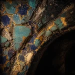 Fractured turquoise and lapis mosaic vault with antique-gold geometric details and a shadowed arch, medieval Islamic-inspired Architecture Wall Art