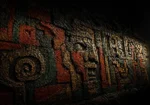 Mesoamerican-inspired ceremonial wall relief with carved faces and geometric symbols in obsidian black, terracotta, oxidized green, and antique gold, Ethnic Wall Art