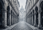 Graphite cityscape art black and white featuring historic façades and a distant domed building